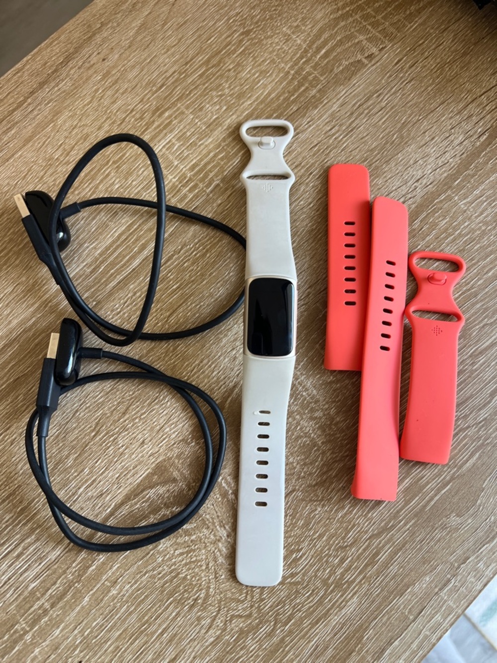 Google Fitbit Charge 6  Color: Coral/Champagne Gold Aluminum White bands Charger